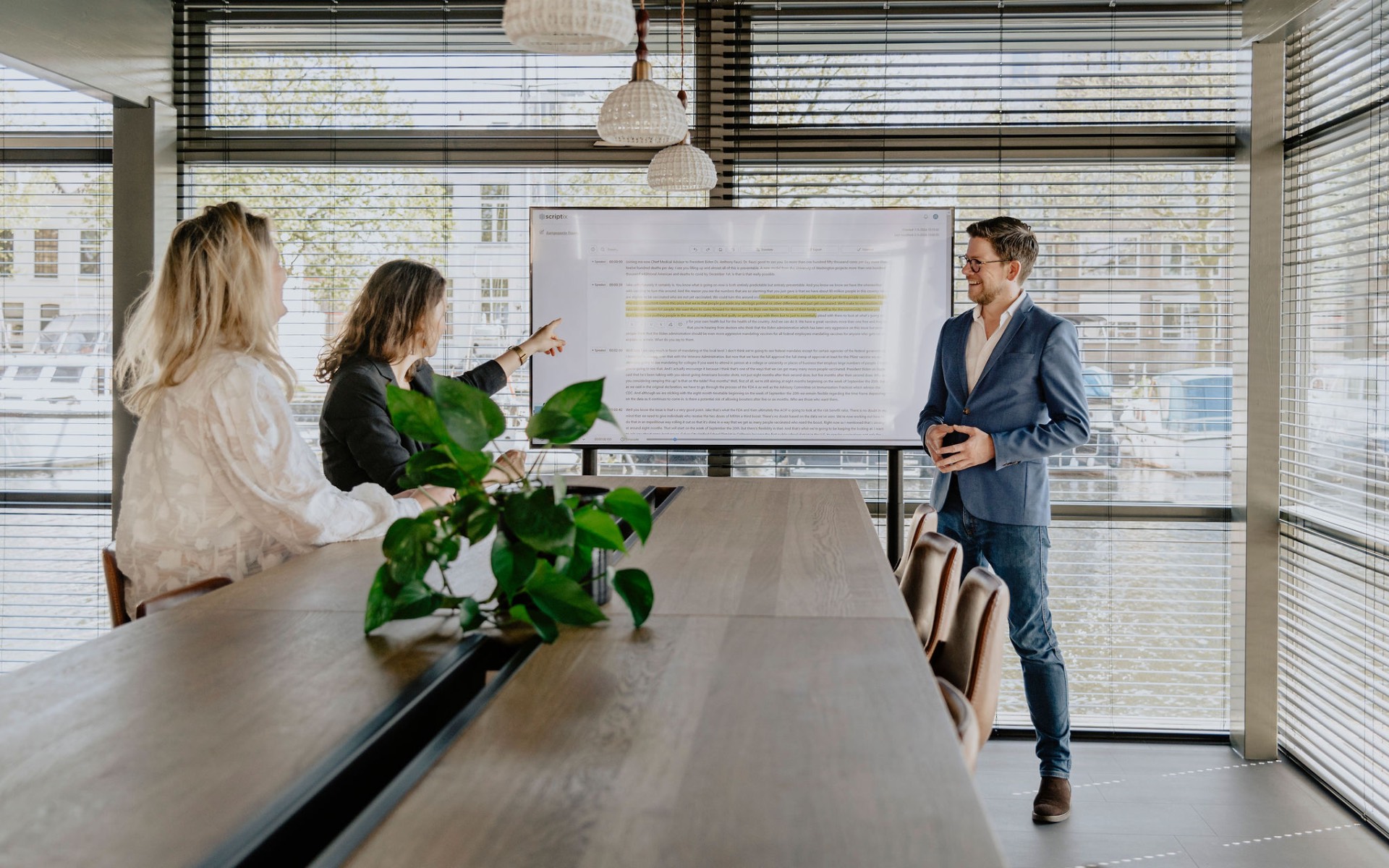 Scriptix team reviewing a transcript on screen